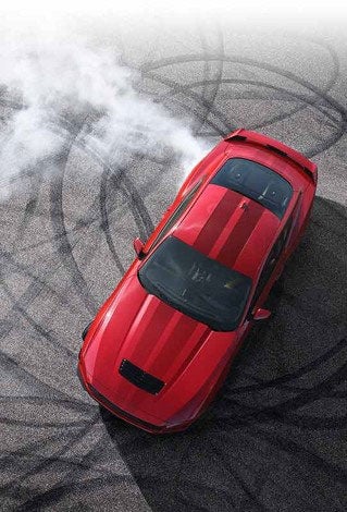 Overhead view of a 2024 Ford Mustang® model with tire tracks on pavement | Freeport Ford in Freeport IL