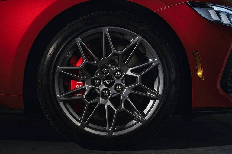 2024 Ford Mustang® model with a close-up of a wheel and brake caliper | Freeport Ford in Freeport IL