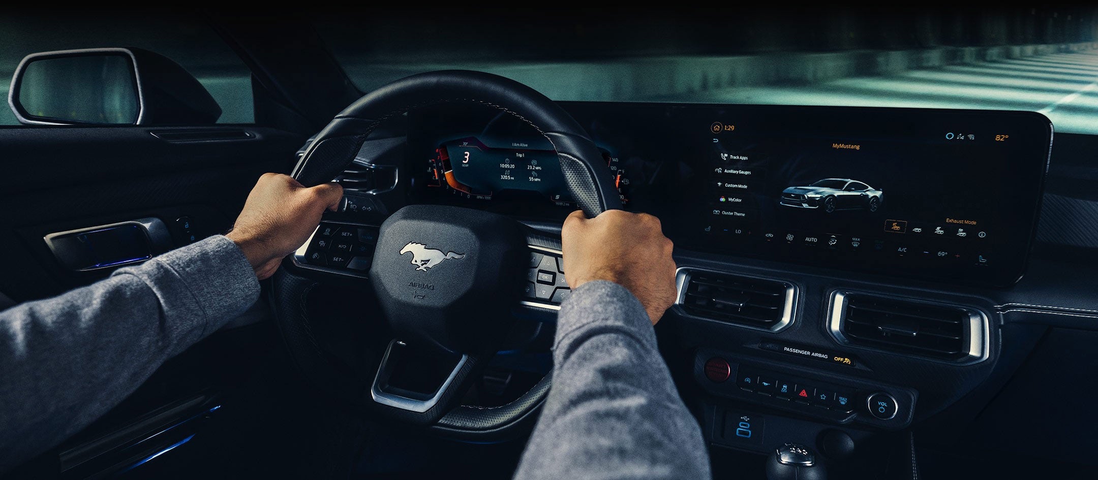 A 2024 Ford Mustang® model interior with a person driving | Freeport Ford in Freeport IL