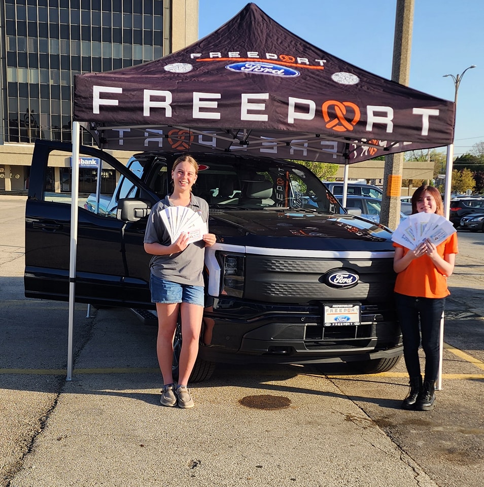 Freeport Ford booth at the Stephenson County Farmer’s Market featuring a new Ford vehicle and heirloom seed giveaway in downtown Freeport, IL