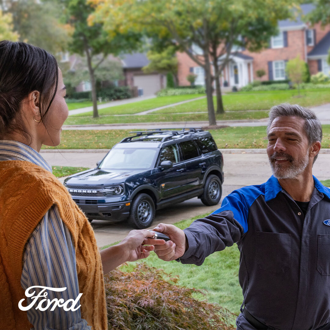 Freeport Ford technician picking up a customer's vehicle for complimentary service in Freeport, IL